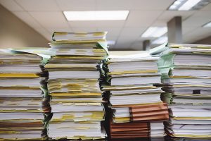 stacks of books and paperwork